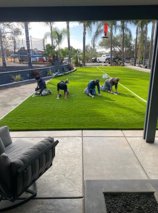 Crew installing commercial artificial turf in Perris, CA