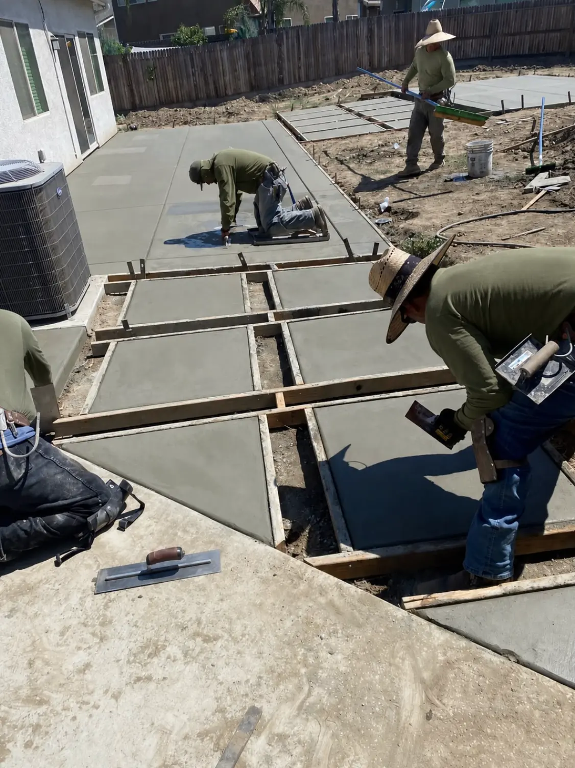 Millenium crew pouring concrete in forms in Perris, CA