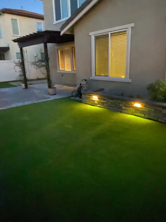 Front yard at dusk with lighting in Perris, CA