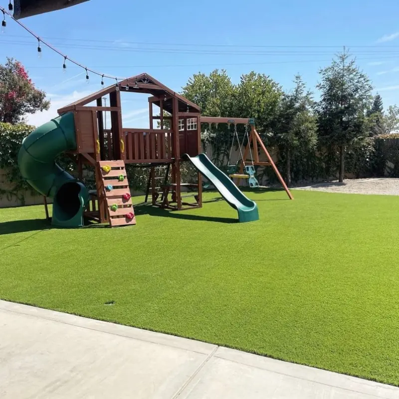 Artificial turf under a backyard play structure in Perris, CA