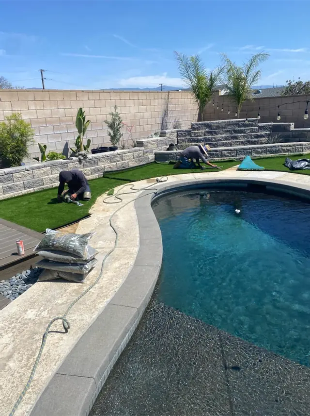 Artificial turf around a pool in Perris, CA