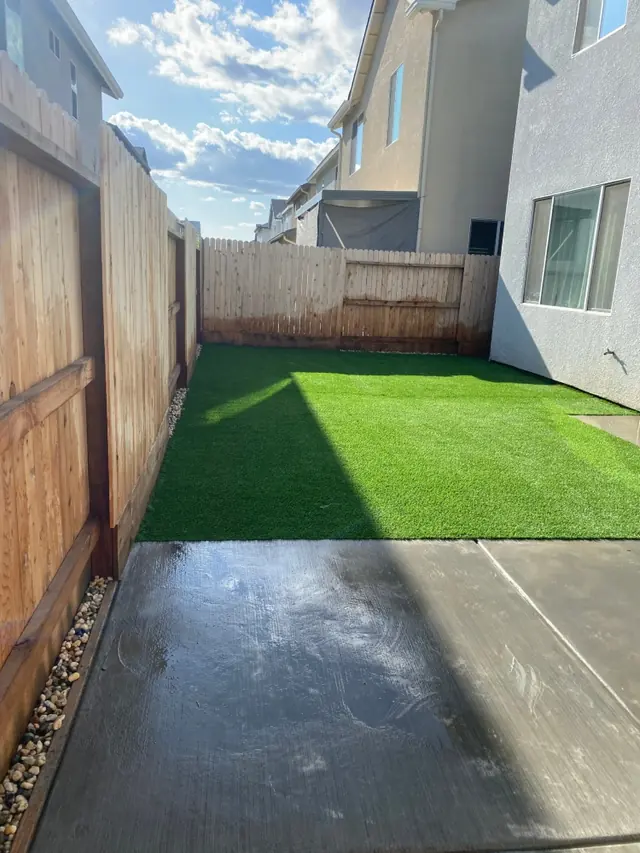 Narrow side yard with turf in Perris, CA